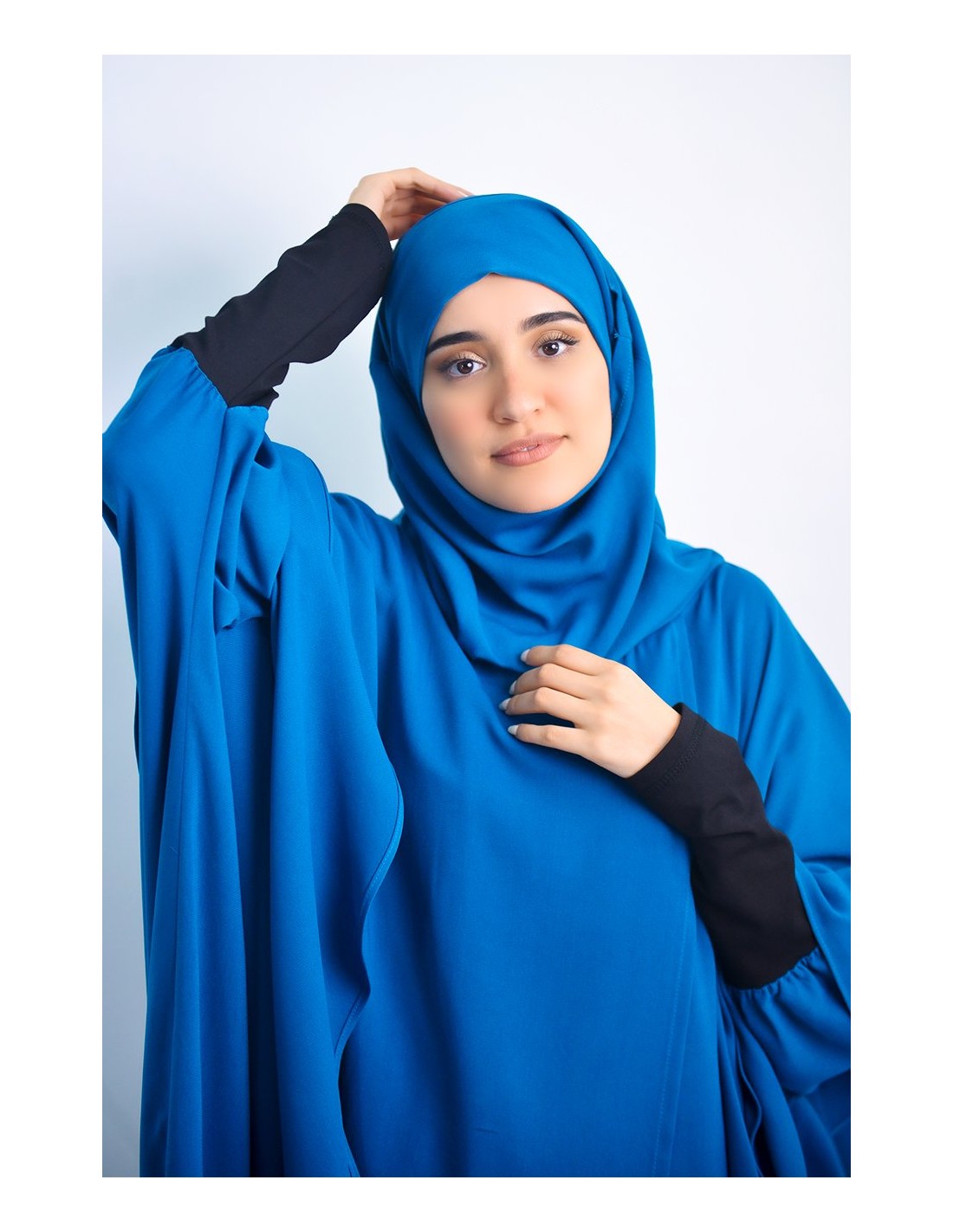 Cape with integrated hijab
